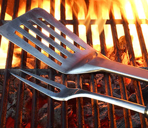 BBQ Tools On The Hot Empty Clean Grill Background