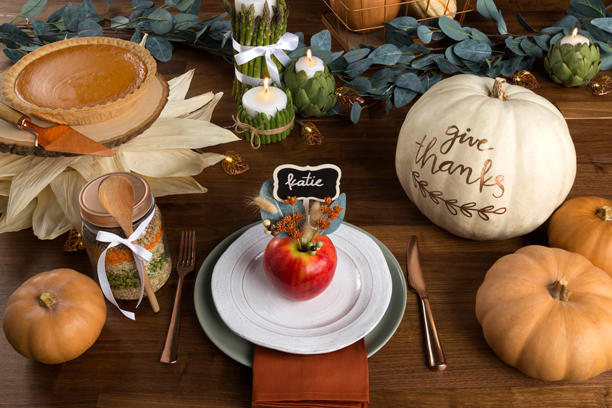 Thanksgiving Table Setting with Pumpkin Pie and Decorative Pumpkins
